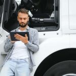 men driver near lorry truck man owner truck driver he5z5mc