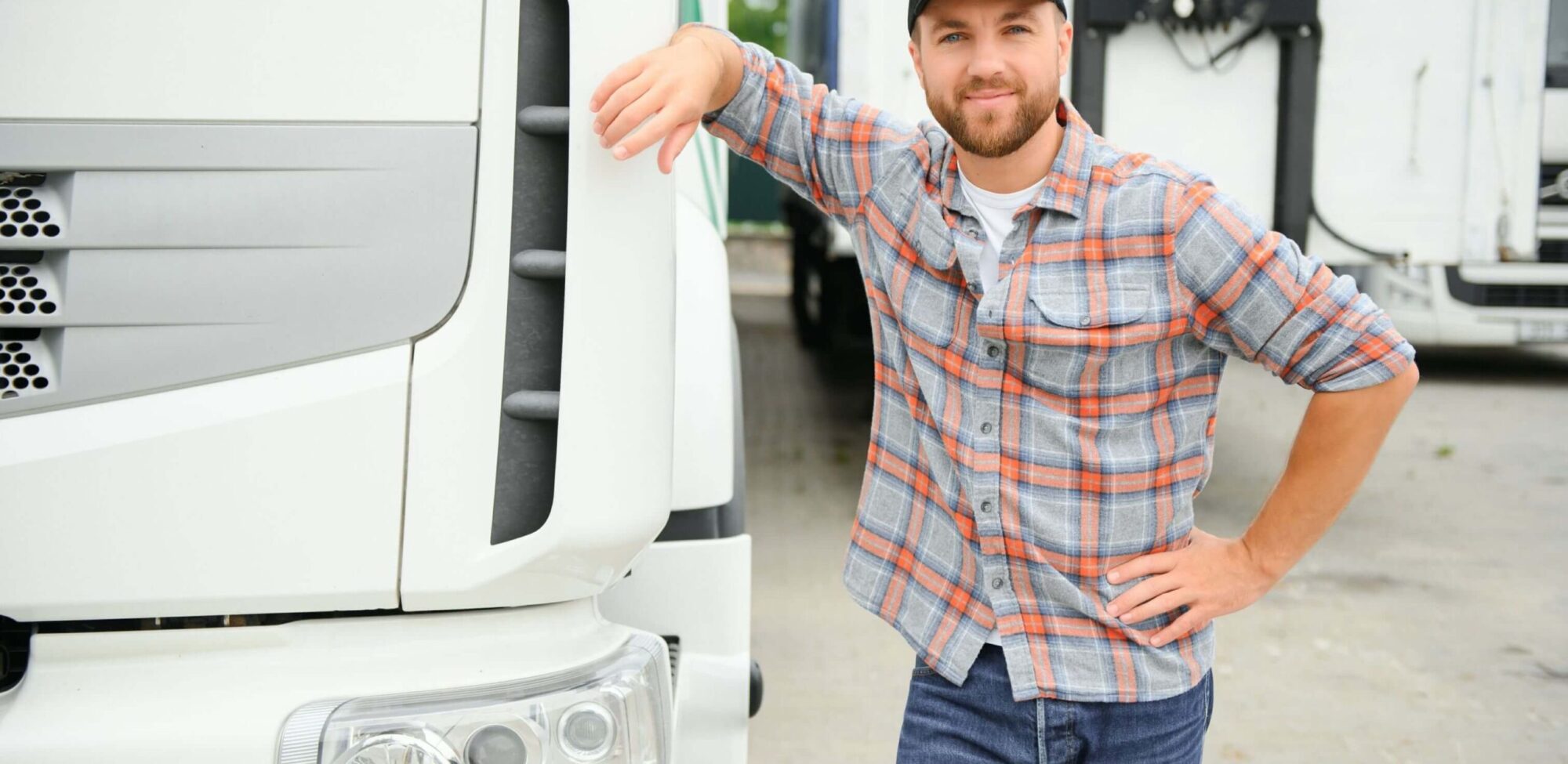 portrait of young caucasian bearded trucker standi ushelbu